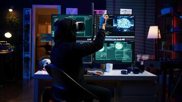 Hacker using virtual reality headset to code malware exploiting network backdoors, bypassing security measures such as logins and password protections using futuristic VR goggles tech, camera B photo