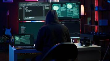 Hacker arriving in secret base with laptop, ready to start programming viruses. Scammer in criminal den opening notebook to exploit network servers and bypass security measures, camera A photo