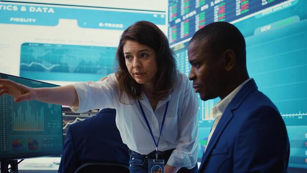 Project manager ensuring productivity and efficiency in creating annual reports, providing guidance for her staff in order to impress the shareholders. Strategic business objectives. Camera B. photo