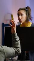 Wife arguing with man gamer during space shooter videogame tournament playing on RGB powerful personal computer. Pro cyber player performing games streaming from home at online championship photo