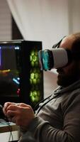 Pro cyber sport gamer wining playing games using vr headset. Virtual space shooter game championship in cyberspace, esports player performing on powerful computer during gaming tournament photo