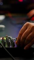 Close up of professional keyboard with RGB lighting streaming at chat. Player using powerful gaming computer in home studio of esport game typing at keypad playing space shooter videogame. photo