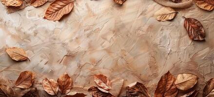 Dried Autumn Leaves Frame on Rustic Burlap Fabric Background photo