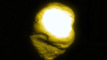 Black background. Motion. Yellow and green abstract uneven spot twitching in different directions in 3d format. video