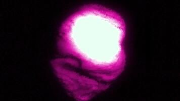 Red and purple background. Motion. A dark background with a small thick ball in the animation that shakes in different directions. video