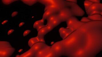 Red animation on a black background. Design. Red separated plasticine in animation that connects and disconnects. video