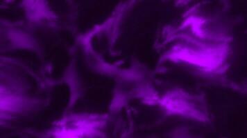 Background with glowing iridescent plasma pattern. Motion. Colored liquid plasma pattern on black background. Moving patterns in plasma fluid video