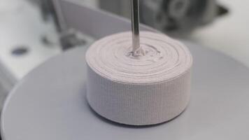 An intricate perspective displays a machine efficiently slicing through a fabric roll video