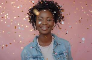 Happy Woman Smiling With Confetti Falling On Pink Background photo