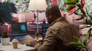 Software engineer coding on a laptop focusing on deep learning, database management and binary code to develop next generation AI solutions and interfaces. Database processing. Camera A. video