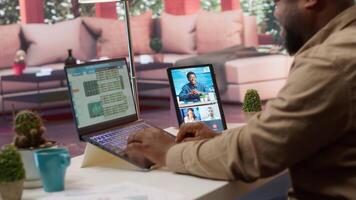 Business owner meeting on videoconference call with shareholders to obtain funding for development project. Entrepreneur attends important startup conference at his house, budget growth. Camera A. video
