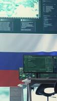 Vertical Empty governmental hacking room with Russian flag on big screen, highlighting cyber terror and misinformation. Russian federation manipulating with disinformation campaigns. Hybrid warfare. Camera B. video