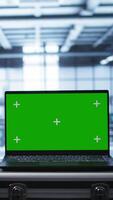 Vertical Isolated screen laptop in data center running error checking software monitoring hardware bugs. Close up of mockup notebook in server hub workspace checking for network issues, camera B video