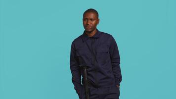 Anxious security guard shaking head, having trouble following orders during protection job shift. Portrait of troubled bodyguard feeling stressed, having problems at work, studio background, camera B video