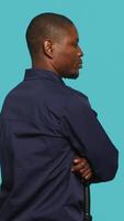 Vertical Portrait of security staff member tasked with evicting trespassers while following legal protocols. Patrolling agent maintaining secure environment, studio background, camera A video