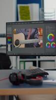 Empty creative workplace with professional computer placed on desk, dual monitor setup. editing start up studio company agency with no people in it and post production software on pc displays video