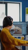 Industrial designer discussing with woman engineer while working in CAD program, designing new components, comparing 3D Prototype with project from laptop. Workteam using computer with two monitors video