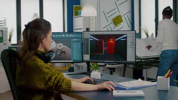 Engineer analysing cad software to develop game, working in startup creative company for prototype. Design technician studying on computer developing new online games with modern technology video