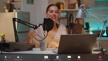 Famous vlogger waving at camera from home studio during chat with followers. On-air online production internet broadcast show host streaming live content, footage with software overlay concept video