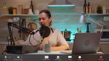 Influencer in entertainment industry talking and checking sound during broadcast from home studio in the night. Recording digital social media communication, footage with software overlay concept video