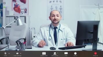 Young doctor on online call offering medical support to patients. Physician using virtual discussion to consult patient, telemedicine and healthcare support, ootage with software overlay concept video