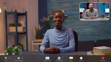 Black manager talking in front of camera having call with work partner. Pov of freelancer working with remotely man discussing during online conference, footage with software overlay concept video
