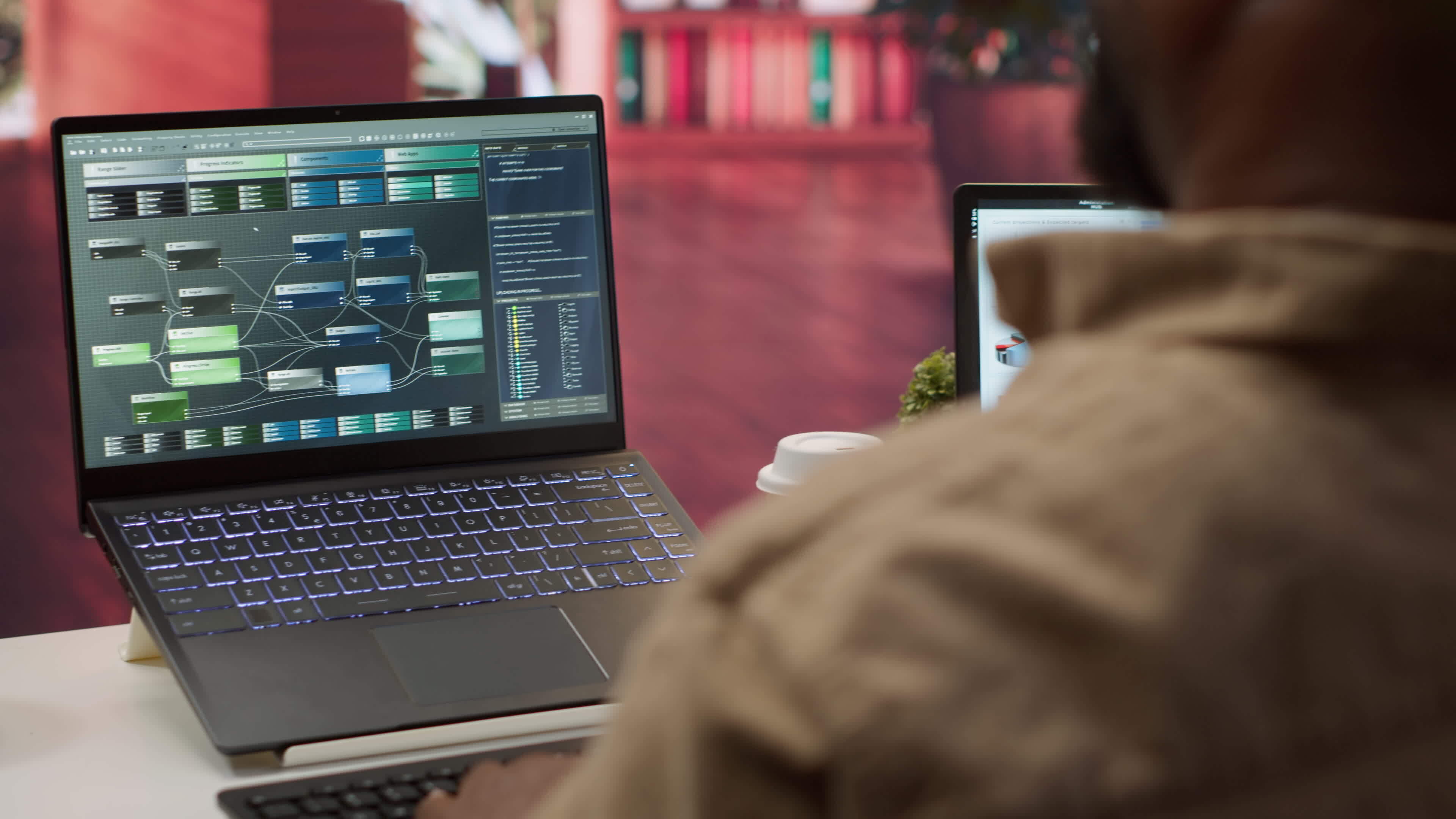 Professional software developer at desk working on AI coding and ...