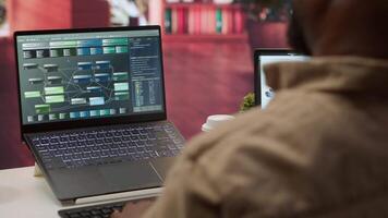 Professional software developer at desk working on AI coding and machine learning projects, showcasing innovation in software development and digital business. Internet of things. Camera A. video
