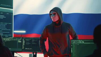 Russian expert working in high tech cyber operations center to collect information through malicious hacking attack. Russian federation spreading fake news and cyberwarfare propaganda. Camera A. video