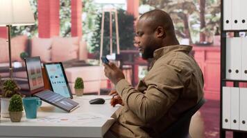 Entrepreneur reviewing statistics data on a laptop remotely from his house, makes a briefing report. Business owner studying sales numbers and the profit to increase organizational funds. Camera A. video