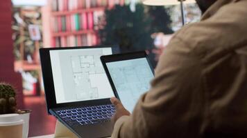Entrepreneur planning an office relocation evaluating architectural blueprints, consulting with interior designers to create an inspiring workspace. Hunting for property leasing. Camera A. video