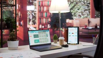 Empty business entrepreneur office setup at home with personal computer and documents showing financial data for startup development. Remote work planning for enterprise growth. video
