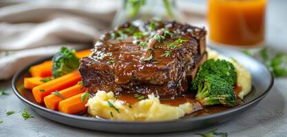 Slow Cooked Ribs With Mashed Potatoes and Carrots photo