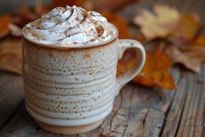Whipped Cream Topped Pumpkin Spice Latte With Fall Decor photo