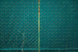 Old rusty chain link fence pattern as design element photo