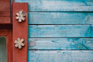 fragment of carved wooden window frame with patterns photo