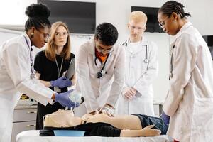 Medical Students Practicing CPR on a Dummy photo