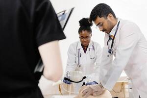 Medical Students Practicing CPR on a Mannequin photo