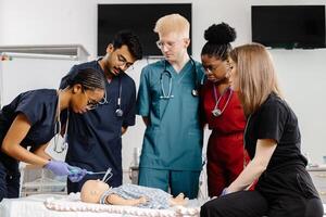 Medical Students Practicing Resuscitation on a Training Dummy photo