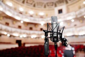 Microphone on the stage front of the empty hall before the concert photo