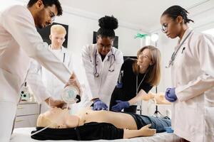 Medical Students Practice CPR on a Dummy photo