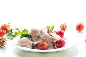 fresh organic cottage cheese with strawberries and ice cream in a plate photo