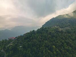 clouds over the mountains, mountains in the fog, during annapurna base camp, ghandruk, nepal photo