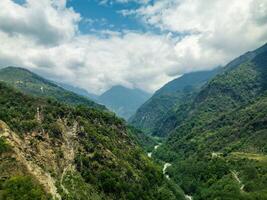 clouds over the mountains, mountains in the fog, during annapurna base camp, ghandruk, nepal photo