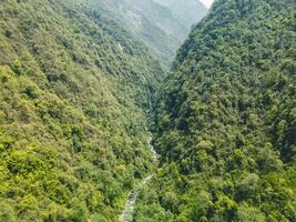 clouds over the mountains, mountains in the fog, during annapurna base camp, ghandruk, nepal photo
