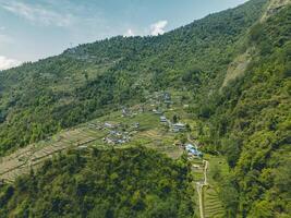 clouds over the mountains, mountains in the fog, during annapurna base camp, ghandruk, nepal photo