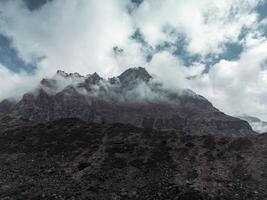clouds over the mountains, mountains in the fog, during annapurna, annapurna base camp nepal photo