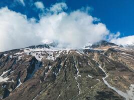 clouds over the mountains, mountains in the fog, during annapurna, annapurna base camp nepal photo