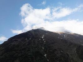 clouds over the mountains, mountains in the fog, during annapurna, annapurna base camp nepal photo