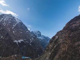 clouds over the mountains, mountains in the fog, during annapurna, annapurna base camp nepal photo
